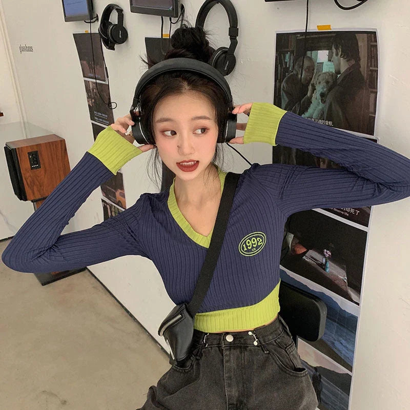 Slim-fit V-neck knit sweater in dark blue with letter pattern and embroidery details