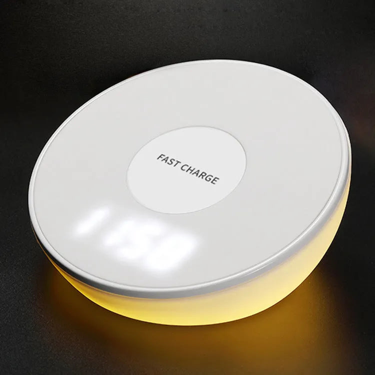 White wireless phone charger with LED digital clock display and three control buttons on the front.