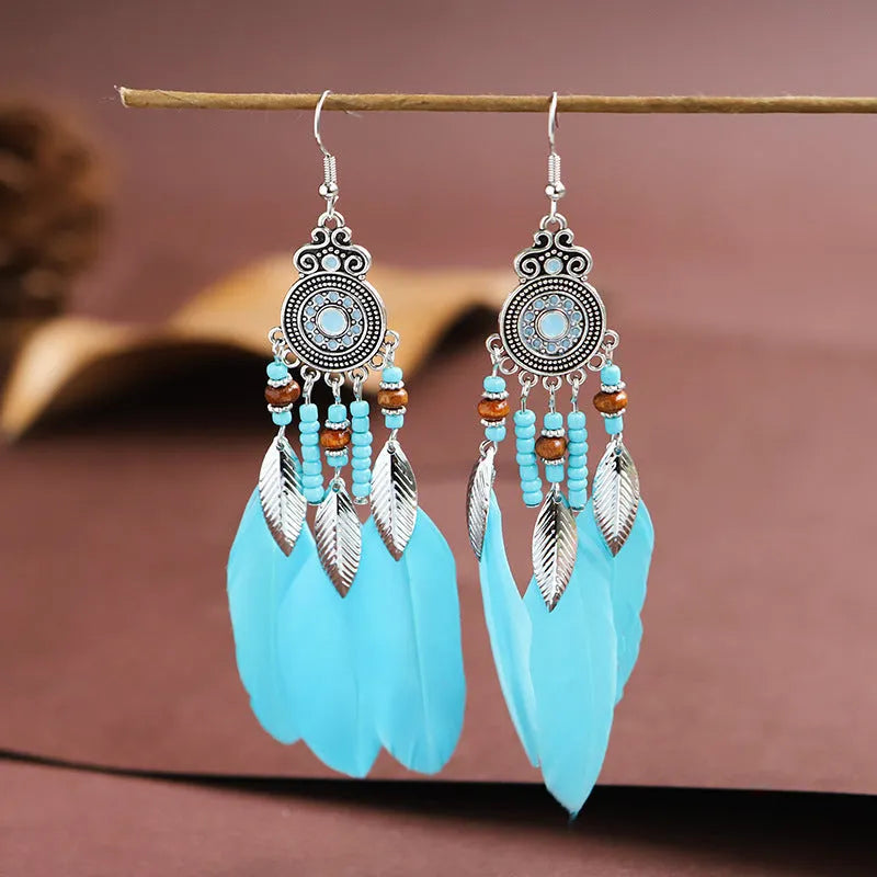 Bohemian feather drop earrings in leaf shape with pattern details, available in multiple electroplated colours.