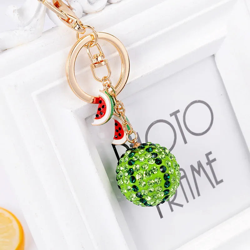 Green zinc alloy watermelon slice keychain measuring 12cm.