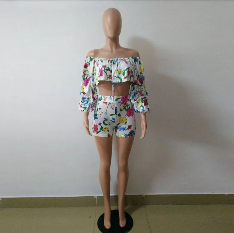 Women's multicolour digital print two-piece playsuit with fluffy pile sleeves and matching shorts.