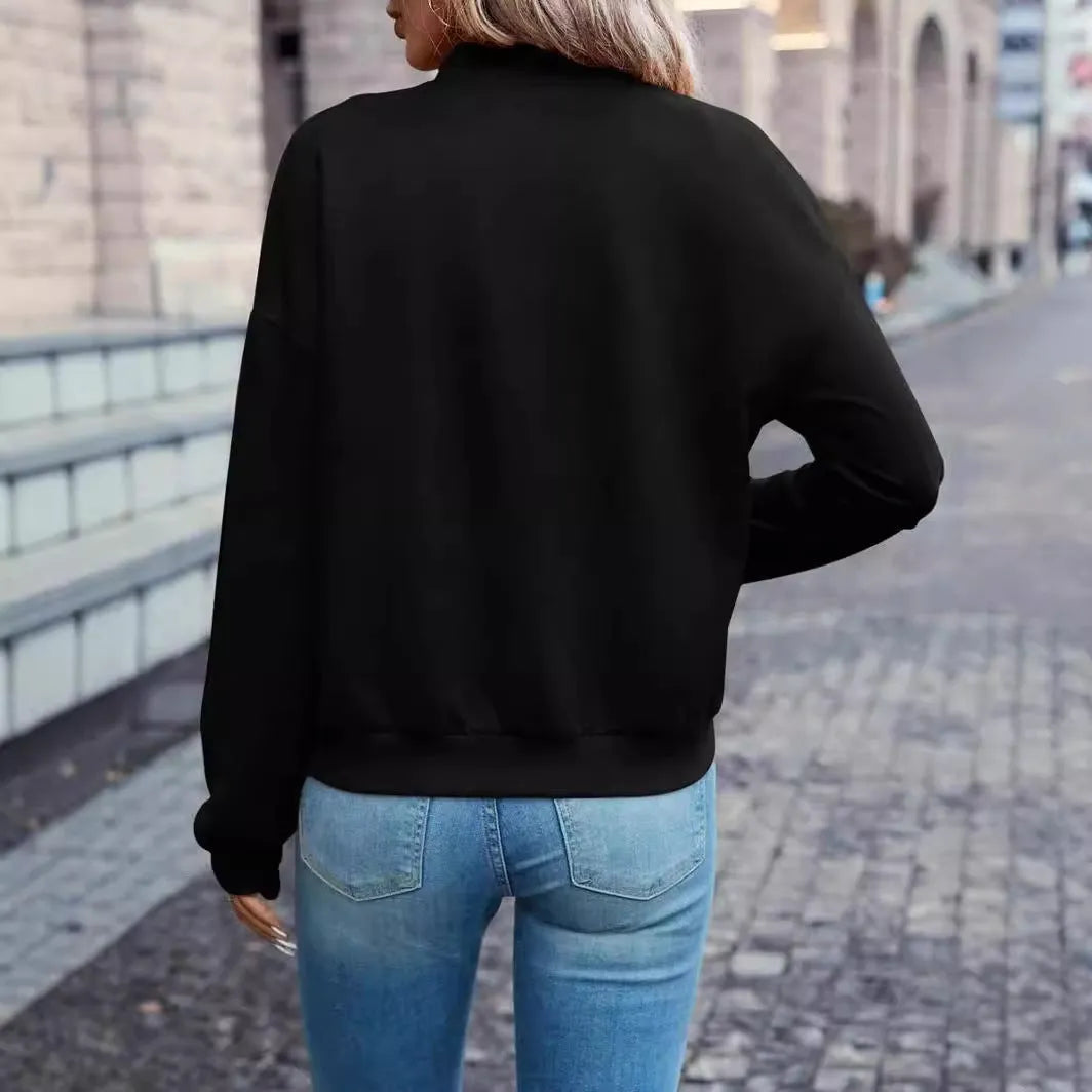 Solid black women's zip jacket with long sleeves and faux pocket details on front.
