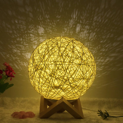 LED rattan table lamp with hand-knit lampshade in various colours