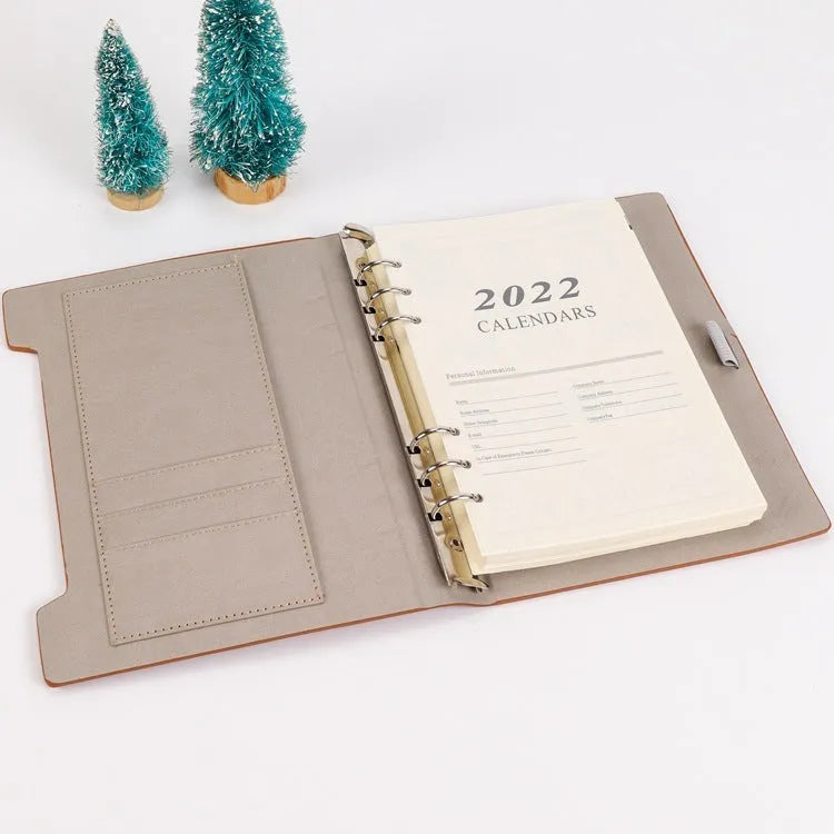 White A5 loose-leaf notebook inner pages with monthly plan layout on paper
