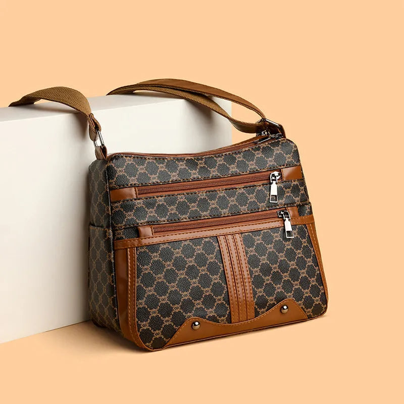 Brown women's crossbody bag with stitching pattern detailing and large storage capacity