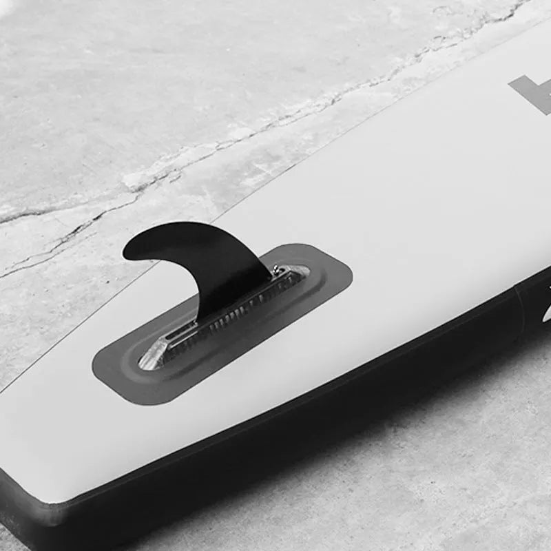 SUP paddle with large removable fish fins showing plastic construction and detachable components