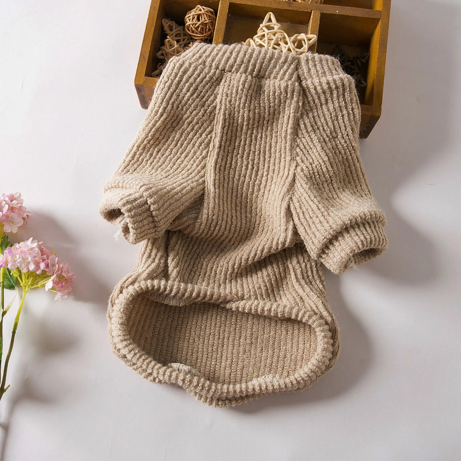 Brown knitted dog sweater jumper on a small dog, showing casual pullover design.