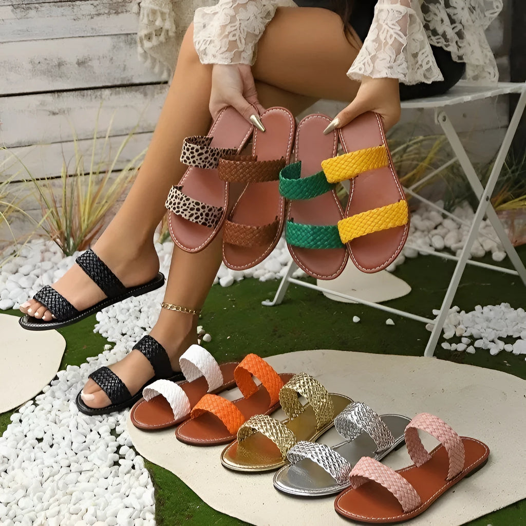 Plus size women's woven beach slipper in synthetic leather, available in multiple colours with a PVC sole.