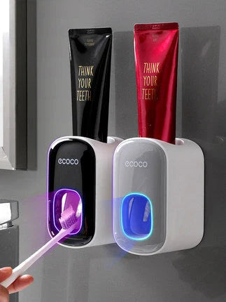 Wall-mounted automatic toothpaste dispenser with upside-down mouthwash cup for convenient and hygienic bathroom organization