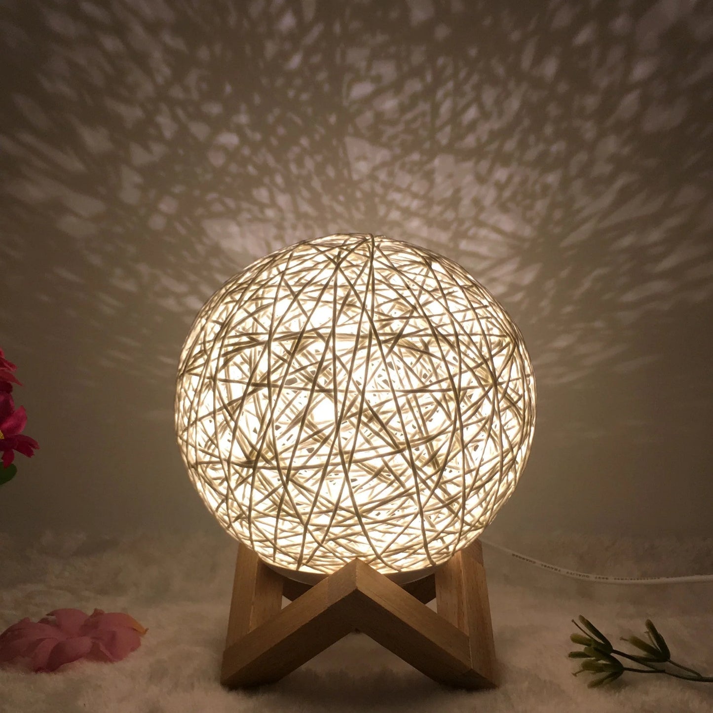 LED rattan table lamp with hand-knit lampshade in various colours