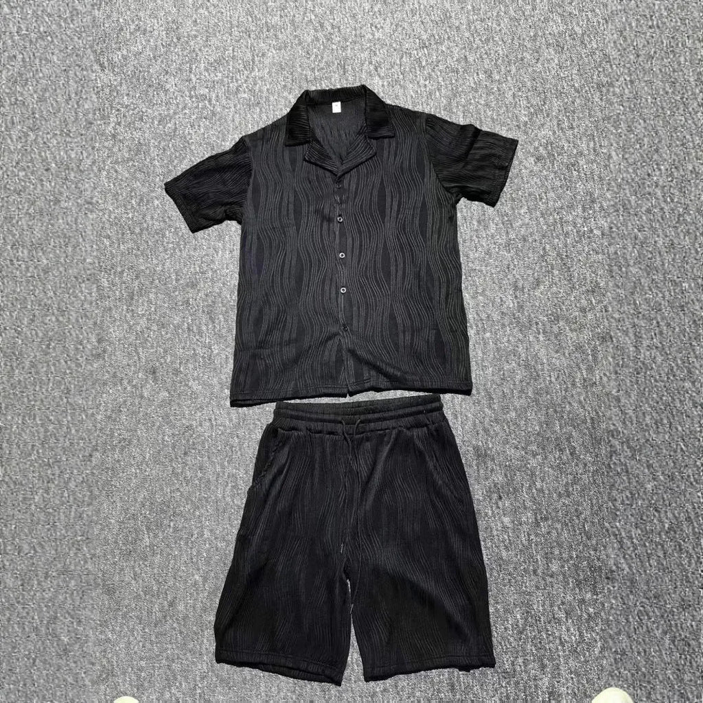 Men's black short sleeve shorts suit with wave pattern texture on cotton blend fabric.