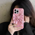 Bow phone case protective sleeve in pink with fall protection for iPhone 13 Pro