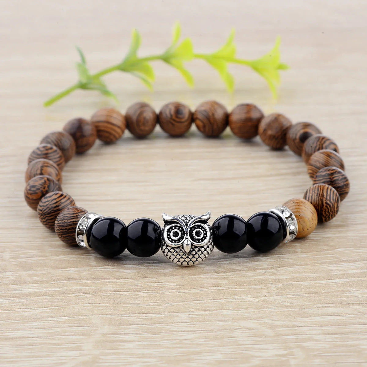Owl frosted stone lifeline wood grain bracelet in black and gold, adjustable for a perfect fit