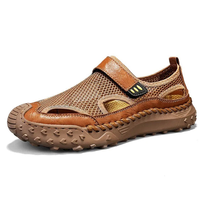 Men's black casual sandals with a mesh upper and velcro strap on a rubber sole.