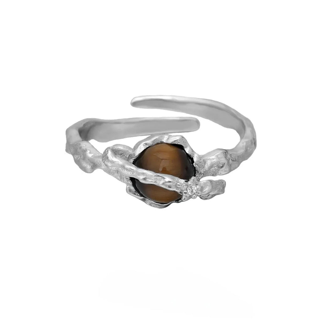 White gold colour Saturn open ring with adjustable opening on silver background