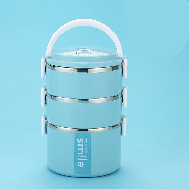 Stainless steel lunch box with built-in spoon, leak-proof design, in green, pink, and blue