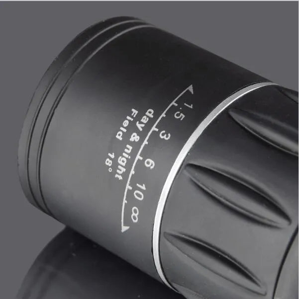 Black 16x52 monocular with large objective lens, shown with focus wheel and BAK4 roof prism optical design.
