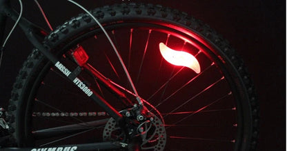 LED bicycle spoke lights attached to bike wheel, showcasing visibility and style options