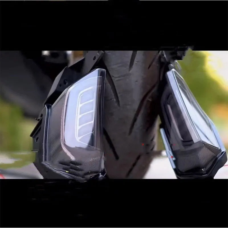 Pair of coloured LED turn signal lights for a Yamaha NMAX155 motorcycle on a white background.