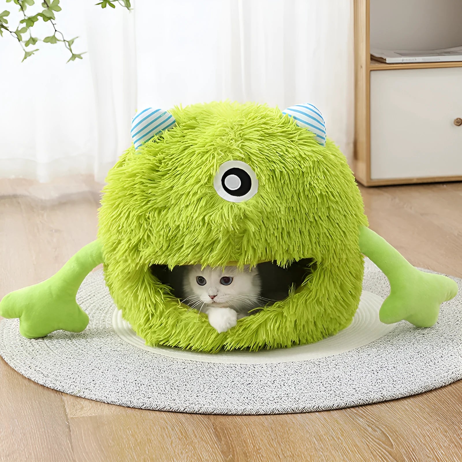Fluffy round plush cat bed with non-slip base shown in three size options