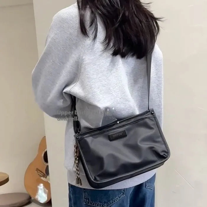 Small square crossbody bag in trendy cool colour made from Oxford cloth with shoulder strap