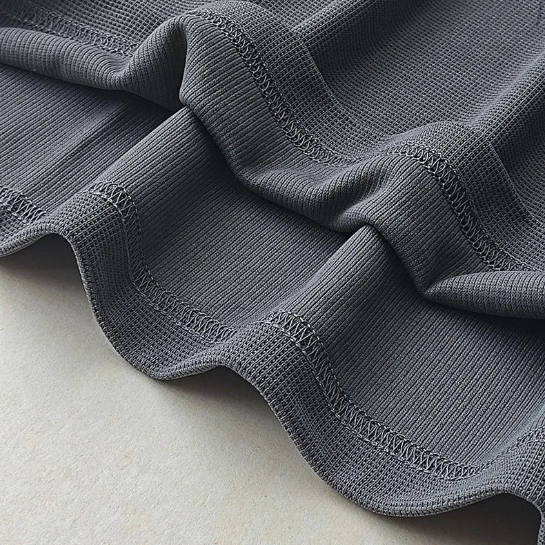 Men's heavy waffle-textured short-sleeved T-shirt in polyester with wool lining, shown in a solid colour.