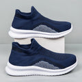 Men's white Popcorn Flyknit low-top fabric casual sneakers with a round toe on a plain background.