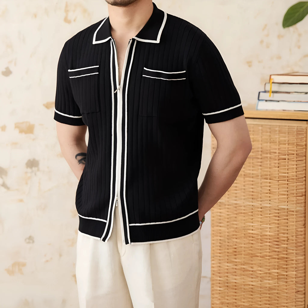 Man's slim-fit black knitted polo shirt with a lapel collar and short sleeves.