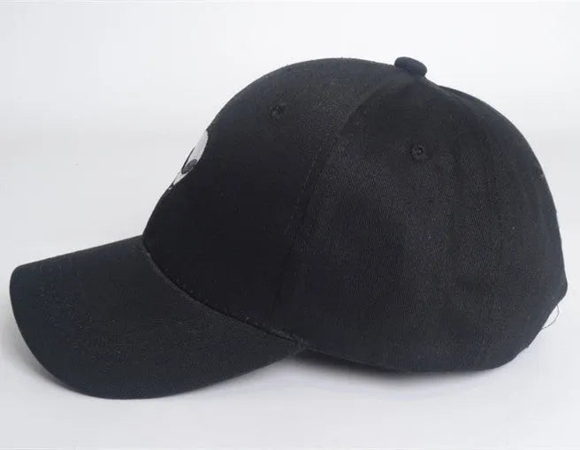 Alien head embroidered baseball cap in black with green label, cotton satin weave, side view