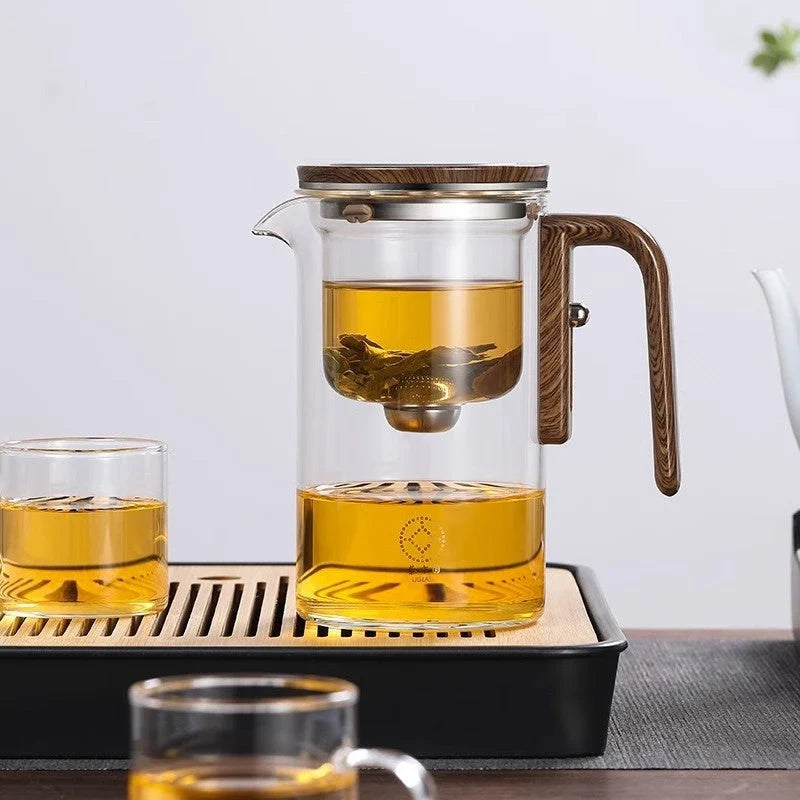 Elegant glass teapot with magnetic separation technology, wooden handle, and drip-free spout for a consistently smooth and flavorful cup of tea