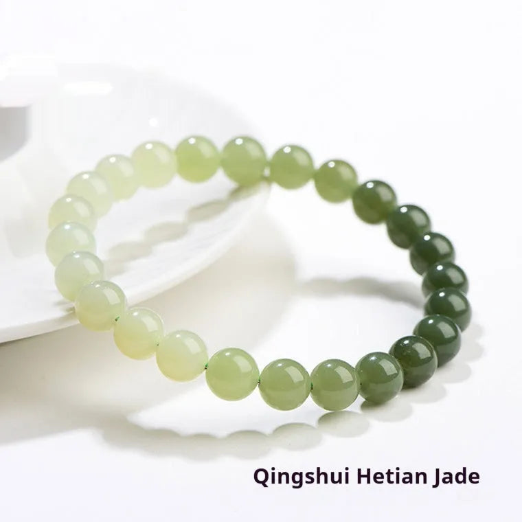 Natural Hetian jade bracelet with gradient water colour round beads on a wrist