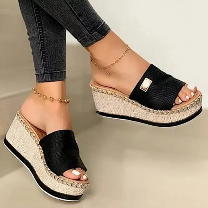 Platform wedge heel sandals with cloth upper in black, side view showing plain pattern and metal element detail