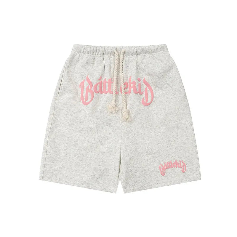 Cotton-blend loose-fit street shorts in black, shown in a casual setting.