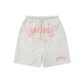 Cotton-blend loose-fit street shorts in black, shown in a casual setting.