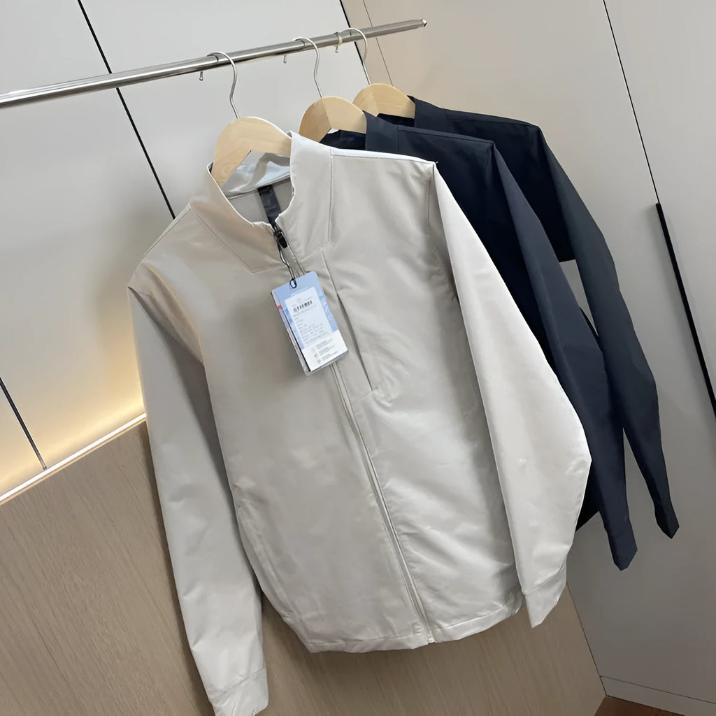 Men's black stand collar casual jacket with long sleeves and a straight hem.