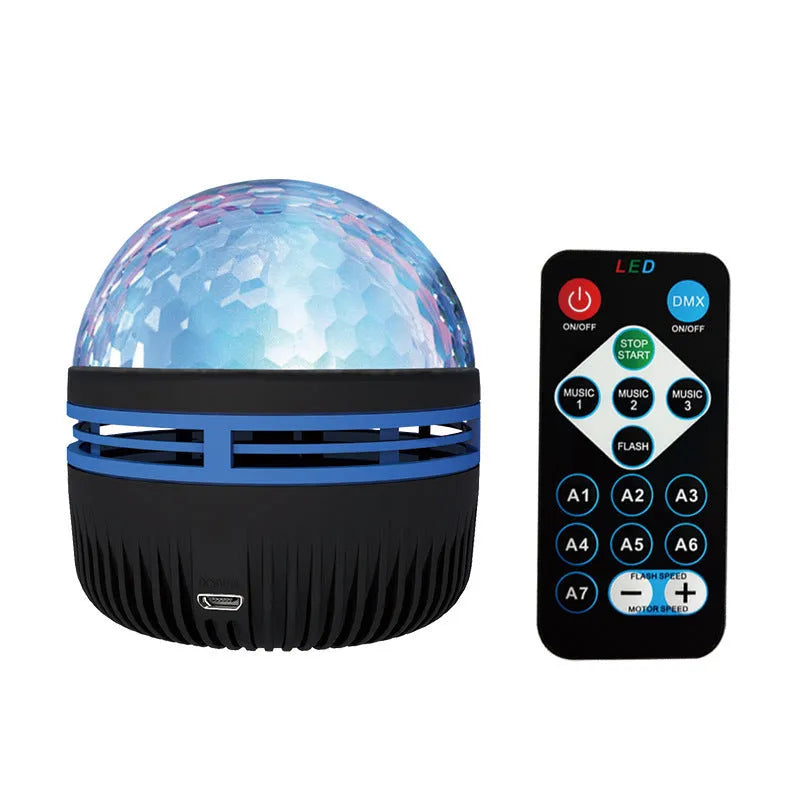 Compact USB-powered LED galaxy projector lamp with remote control on a table