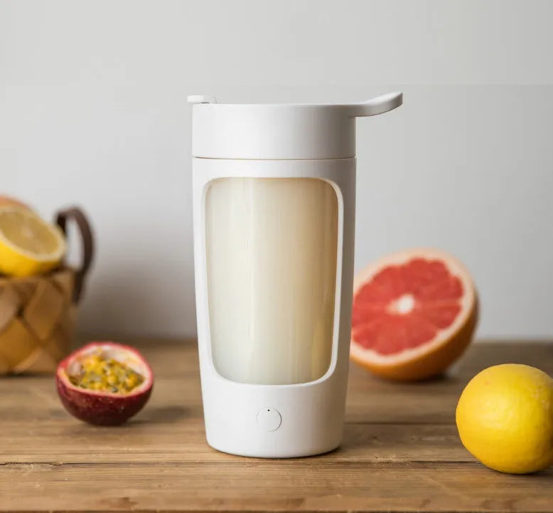 Cordless portable blender in blue with a 650ml blending cup and lid.