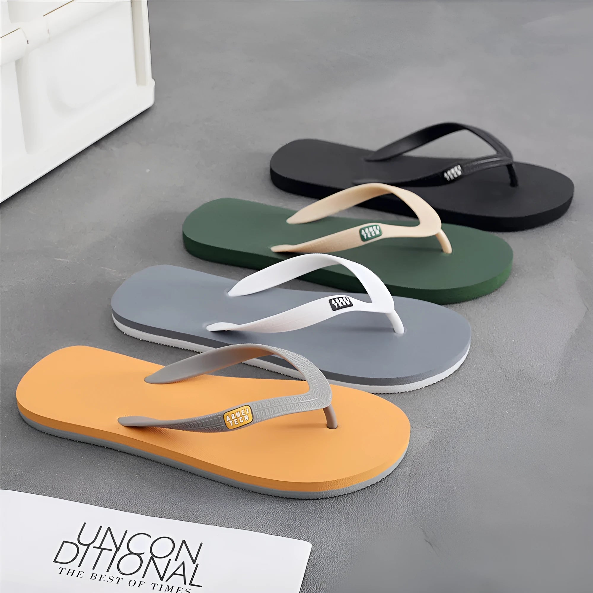 Men's flip-flops with rubber sole and EVA upper in black, green, orange, and grey colour options.