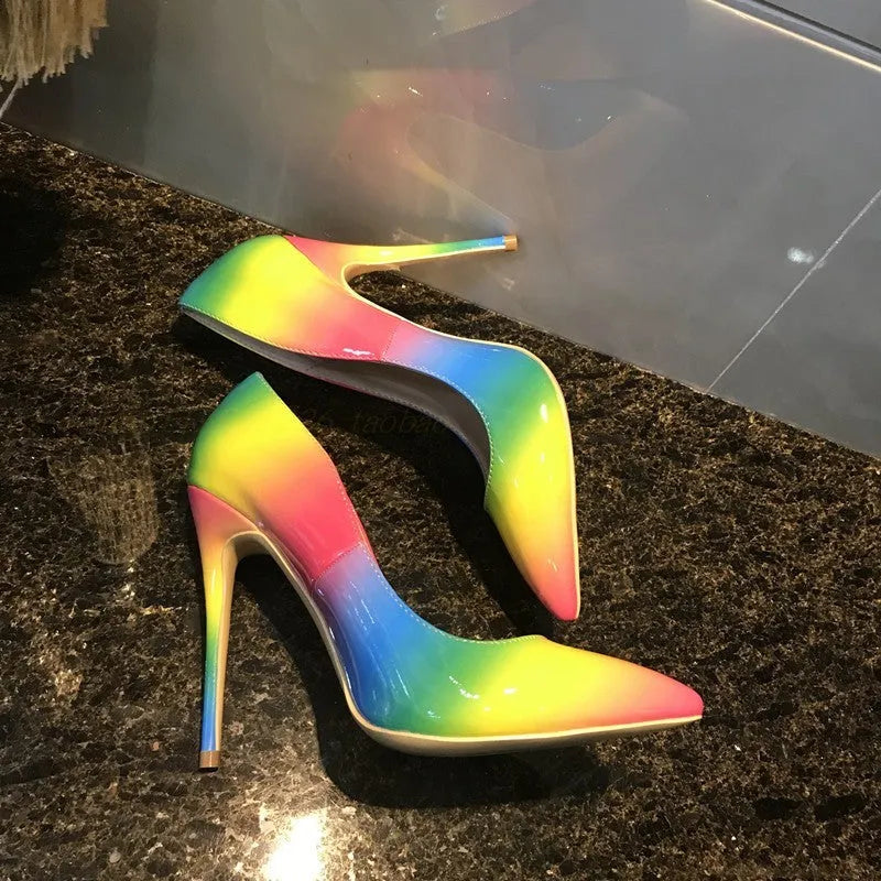 Rainbow patent leather women's ultra-high heel shoes with pointed toe and thin heel.