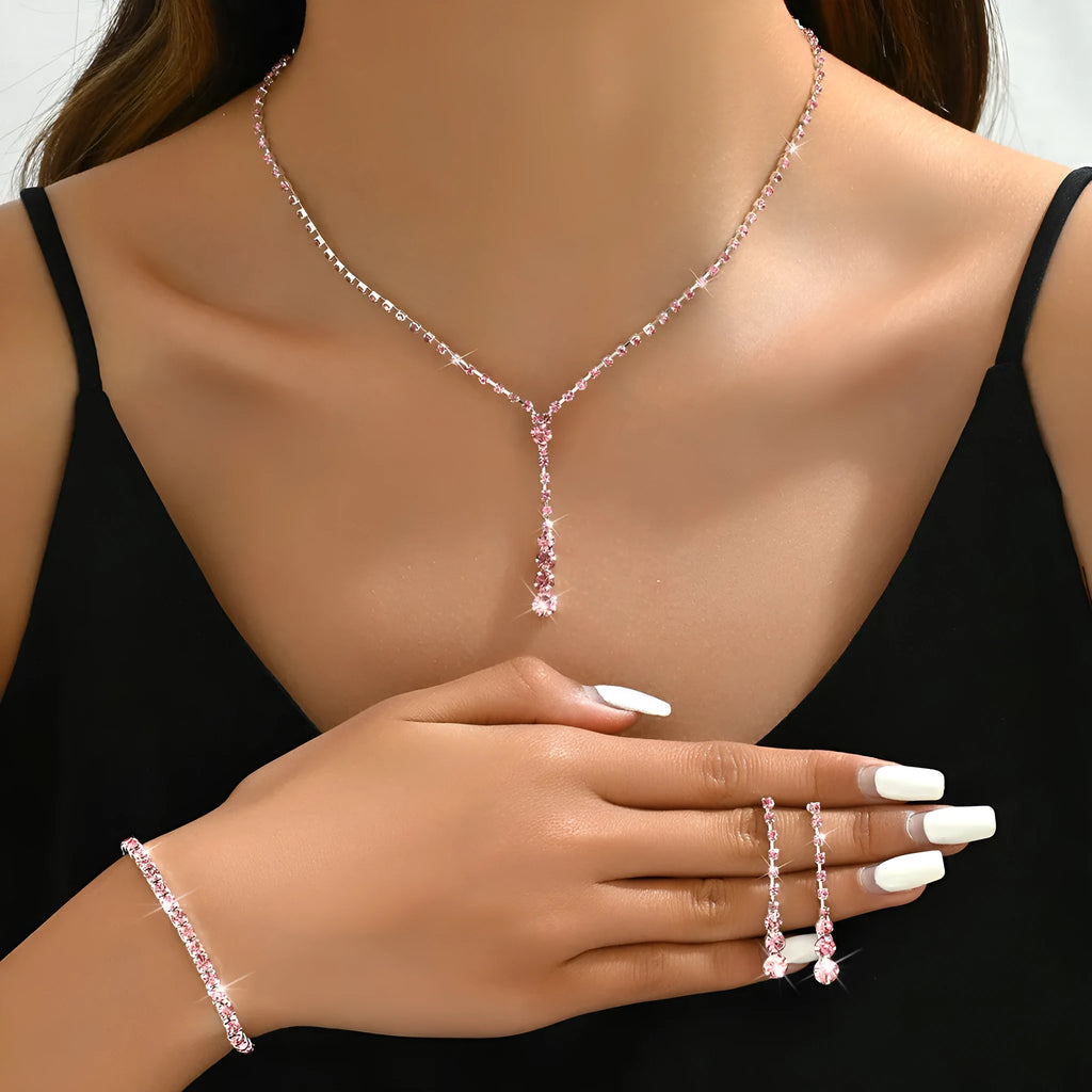 Bridal jewellery set with rhinestone heart necklace, elastic bracelet, and matching earrings with tassel details