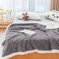 Taffon double-layer washable polyester sofa blanket in multiple colours and sizes on a modern sofa