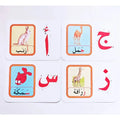 28 paper children's recognition literacy cards covering English and number learning laid out on a flat surface