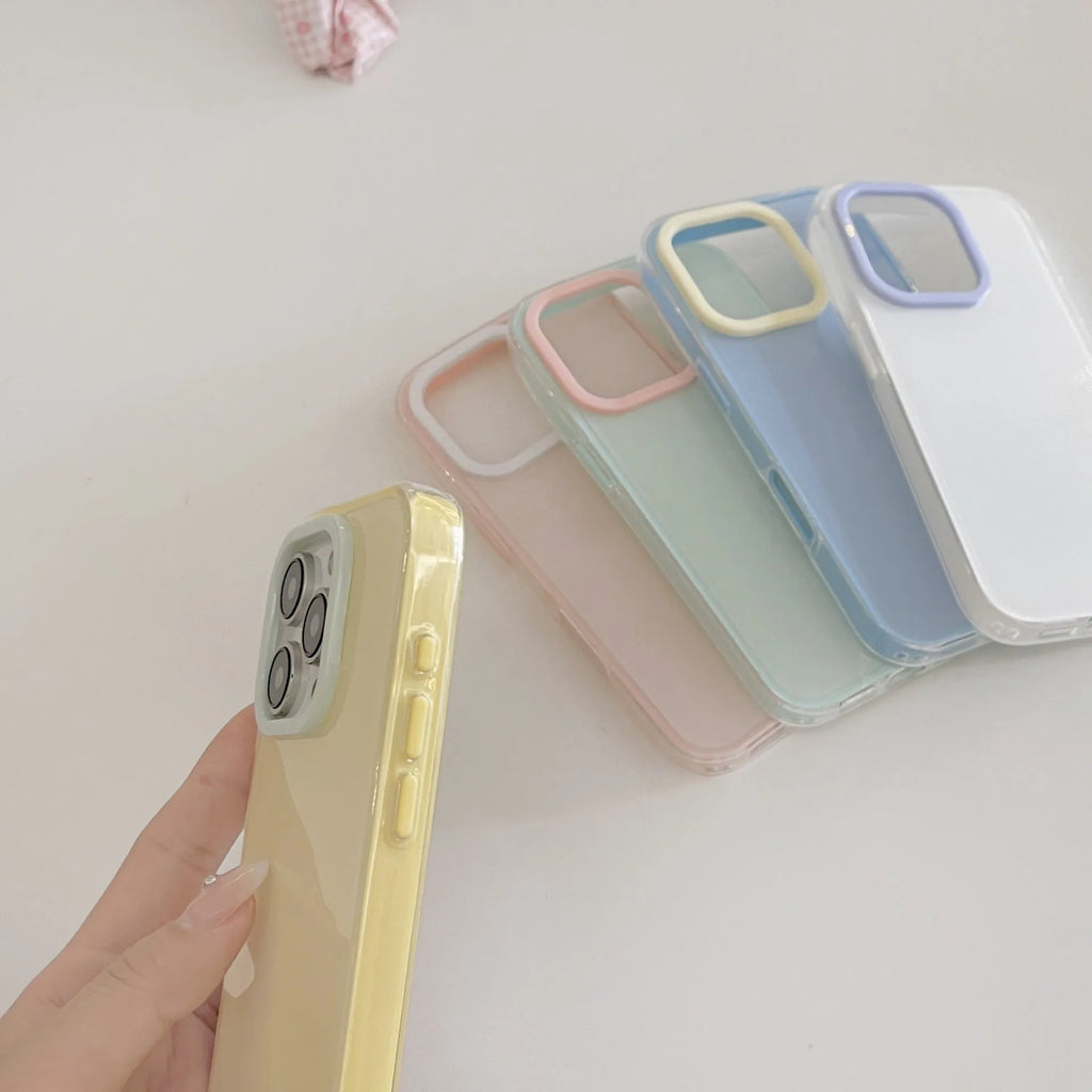 Clear jelly iPhone phone case in solid blue colour on an iPhone, showing bumper-style all-inclusive protection.