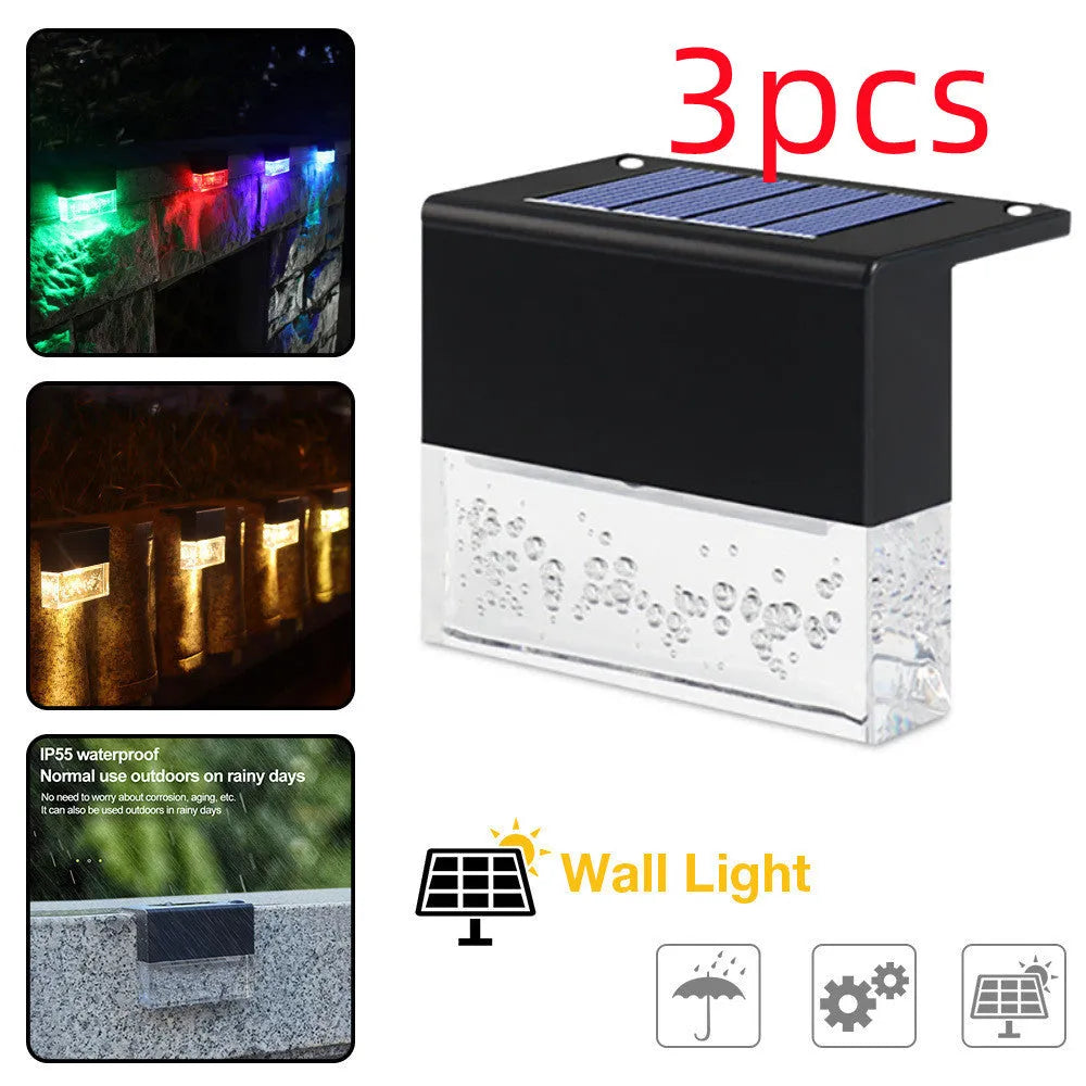 IP65 waterproof solar step light with crystal-like amber cover and RGB LED on a garden path