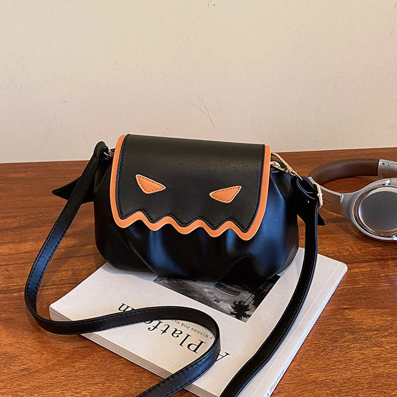 Halloween pumpkin cartoon crossbody bag with wings in black, white, and orange