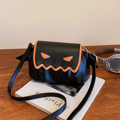Halloween pumpkin cartoon crossbody bag with wings in black, white, and orange