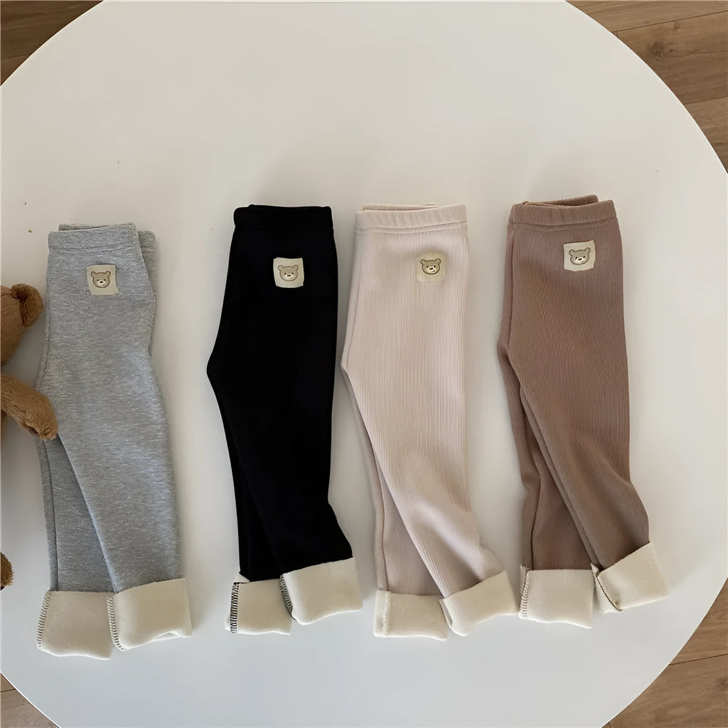 Girls solid colour fleece-lined leggings with high waist and hair band belt, shown in beige, black, brown, grey.