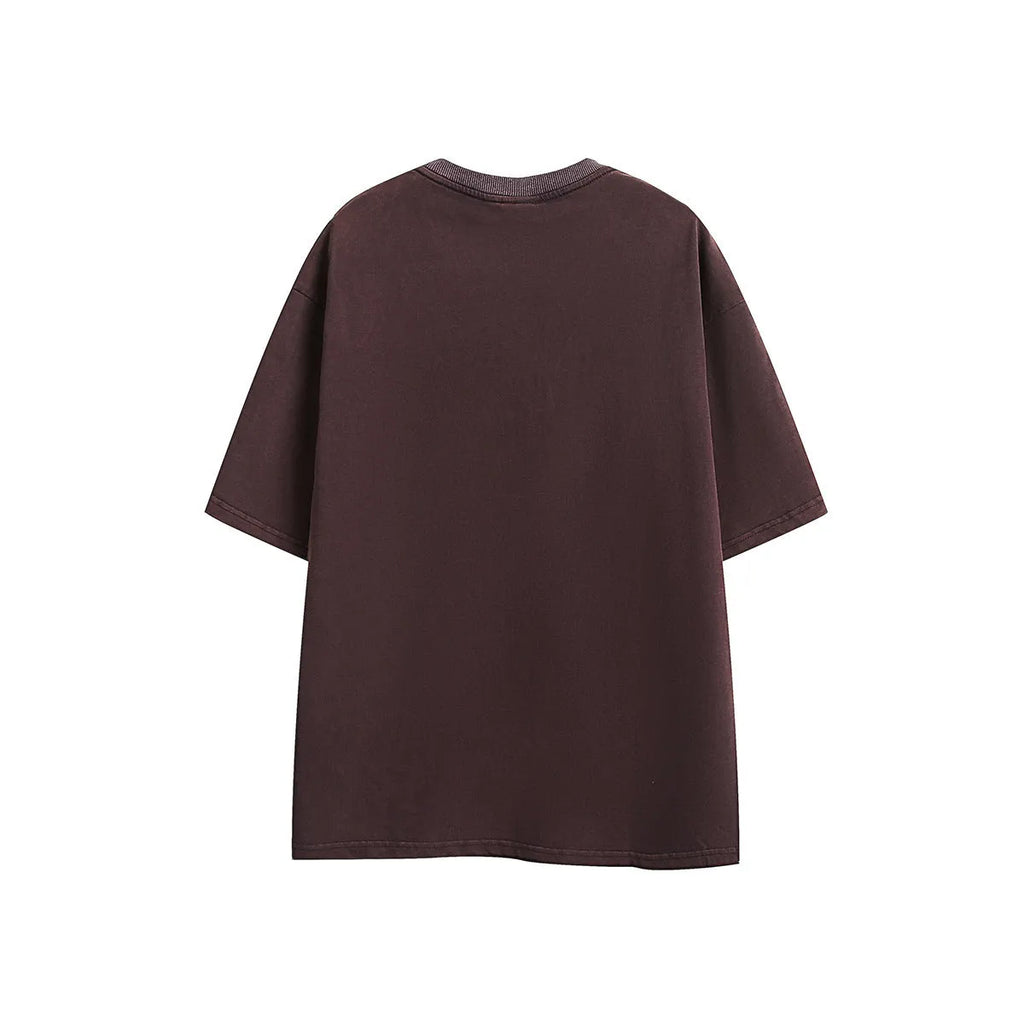 Loose fit purple short-sleeved cotton T-shirt with retro embroidery on a hanger.