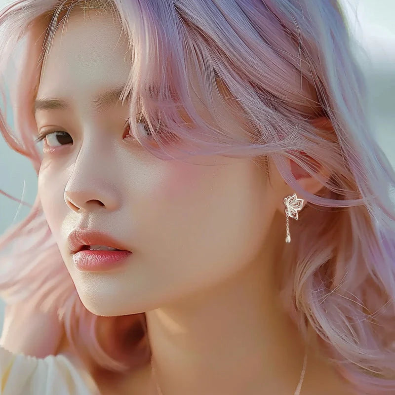 Women's S999 Sterling Silver Butterfly Tassel Earrings showcasing intricate design and shine