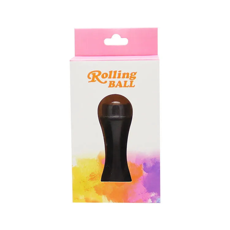 Portable black volcanic stone facial roller for oily skin control and makeup touch-ups.